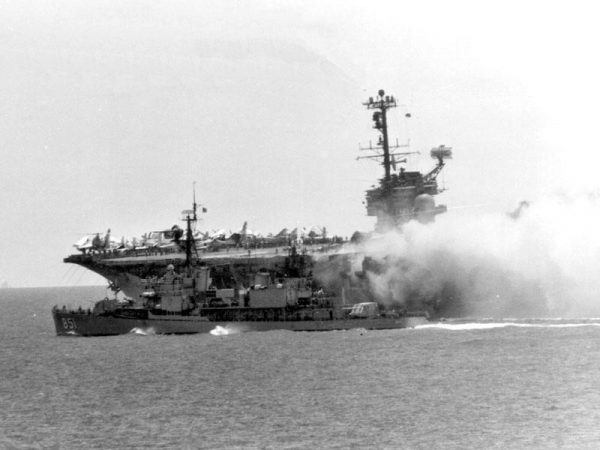 USS Rupertus aiding firefighting efforts on USS Forrestal during the 1967 fire